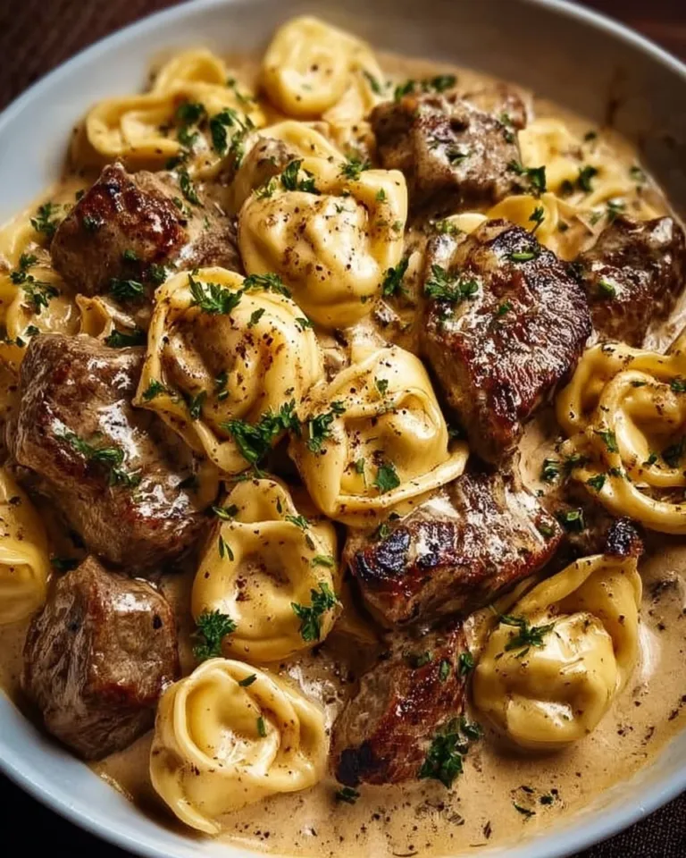 Cracked Garlic Steak Tortellini in rich creamhouse sauce served in a bowl