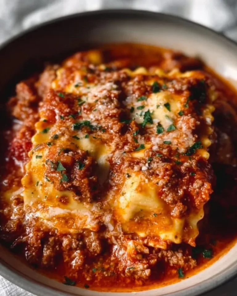 Delicious Crockpot Ravioli Lasagna layered with cheese and sauce