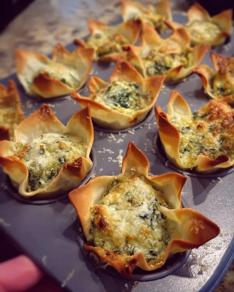 Spinach and artichoke wonton cups appetizer served on a plate
