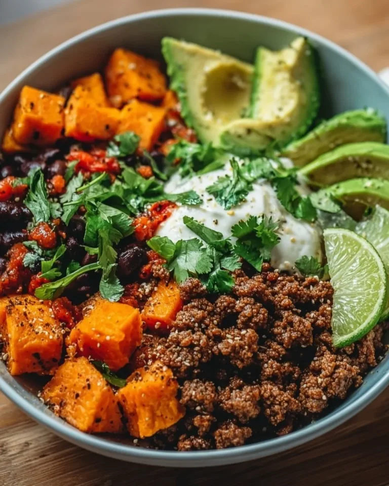 Colorful Sweet Potato Taco Bowl with black beans, avocado, and fresh toppings.