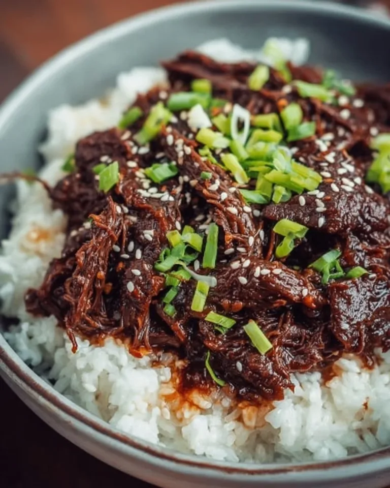 Delicious slow cooker Korean beef dish served with rice and vegetables