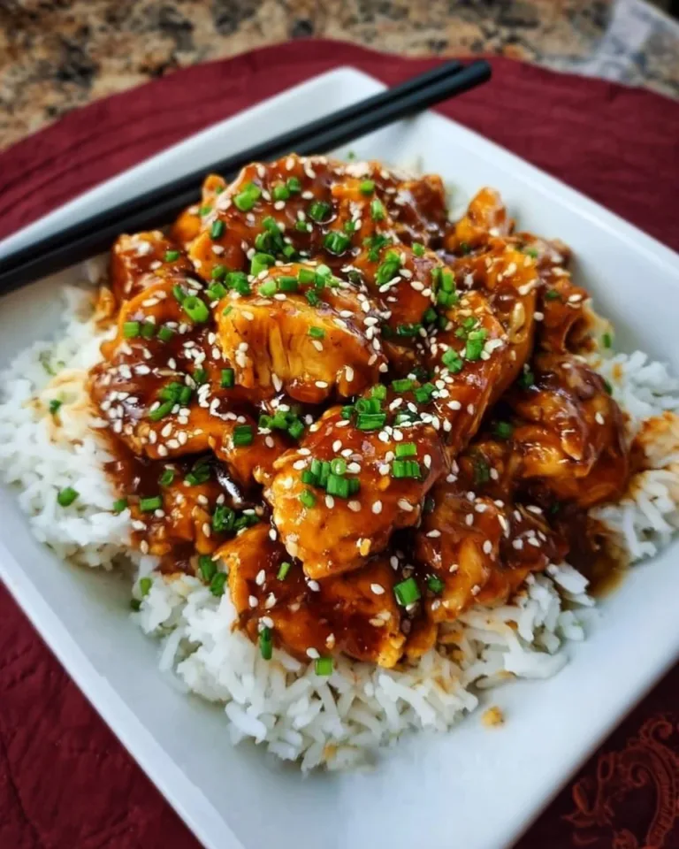 Delicious Instant Pot Honey Garlic Chicken served on a plate with vegetables.